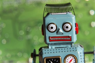 Vintage tin toy robot with computer board, artificial intelligence concept