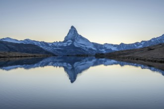 Matterhorn Mountain and Reflection in Lake Stellisee in Evening Twilight. Swiss Alps. Valais,