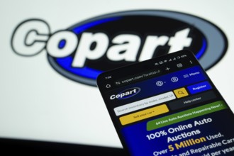 Dhaka, Bangladesh- 03 July 2025: Smartphone displaying Copart web interface against Copart logo