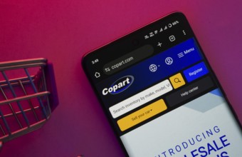 Dhaka, Bangladesh- 23 June 2025: A smartphone displaying the Copart website with a shopping cart is