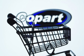 Dhaka, Bangladesh- 03 July 2025: Silhouette of a shopping cart in front of the Copart logo,