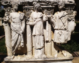 An ancient relief composition with antique statues (an archaeological find from the Ancient Greek