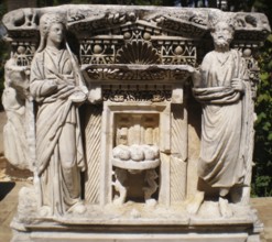 Ancient relief engravings composition with statues (eras of ancient Greece) in the pavilion of the