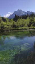 Zelenci Nature Reserve with a view of Triglav National Park, Slovenia
