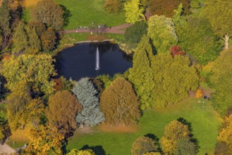 Aerial view, fountain and lake in city garden with autumn trees, Südviertel, Essen, Ruhr region,