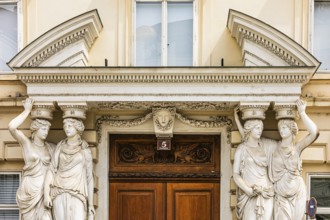 Women as supporting marble statues at a historic building, Josefsplatz, Vienna, Austria
