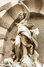 Marble statue of a crowned woman on the façade of the Hofburg Imperial Palace, Vienna, Austria