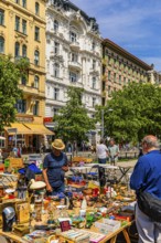 Antique and flea market, on the Chain Bridge south of the Naschmarkt, behind the historic facades