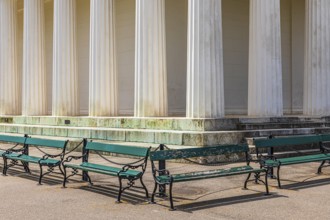 Columns of the Temple of Theseus, with green benches in front of it, Volksgarten, Vienna, Austria