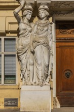 Women as supporting marble statues at a historic building, Josefsplatz, Vienna, Austria