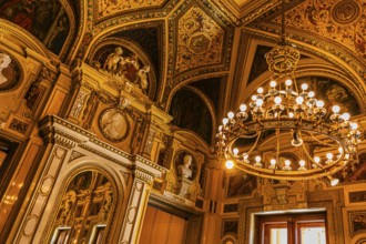 Sumptuous room and chandelier in the Vienna State Opera, Vienna, Austria