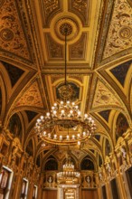 Sumptuous room and chandelier in the Vienna State Opera, Vienna, Austria