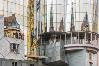 Historic buildings are reflected in the glass façade of the Haas House, Stephansplatz, Vienna,