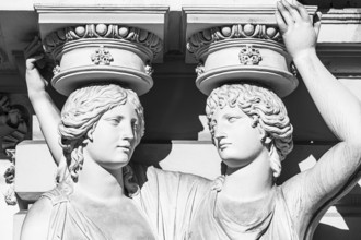 Women as supporting marble statues at a historic building, black and white photo, Josefsplatz,