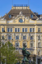 Bronze statue on the Donnerbrunnen at Neuer Markt, the historic façade of the Herrenhuterhaus in