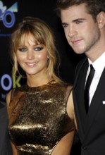 Jennifer Lawrence and Liam Hemsworth at the Los Angeles premiere of 'The Hunger Games' held at the