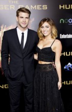 Liam Hemsworth and Miley Cyrus at the Los Angeles premiere of 'The Hunger Games' held at the Nokia