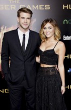 Liam Hemsworth and Miley Cyrus at the Los Angeles premiere of 'The Hunger Games' held at the Nokia