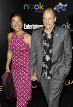 Woody Harrelson and Laura Louie at the Los Angeles premiere of 'The Hunger Games' held at the Nokia