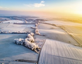 Bird Eye Perspective of Frost Covered Farmland. Seasonal Agricultural Scenery, winter and autumn