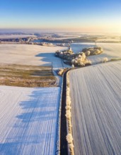 Bird Eye Perspective of Frost Covered Farmland. Seasonal Agricultural Scenery, winter and autumn