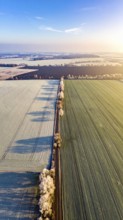 Bird Eye Perspective of Frost Covered Farmland. Seasonal Agricultural Scenery, winter and autumn