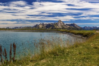 The panoramic lake at Saloberkopf with mountains in the background under a blue sky, Wart, Bregenz,