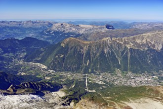 View from the Aiguille du Midi mountain station observation deck into the valley with the city,