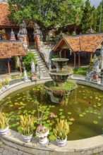 Old fountain in Brahma Vihara Arama Buddha Banjar Buddhist monastery, Banjar, Bali, Indonesia