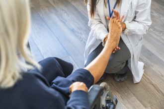 Medical professional in a white lab coat examining a senior patient's bare foot, providing care and
