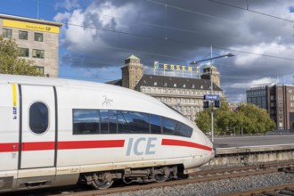 ICE train on track 2 in Essen main station, view of the city center, Handelshof building with Essen