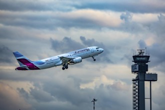 Eurowings Airbus A320 taking off from Düsseldorf Airport, Air Traffic Control Tower, North