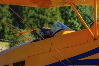 A biplane Bücker Bü 131 Jungmann with registration SP-YPZ during a flight demonstration as part of