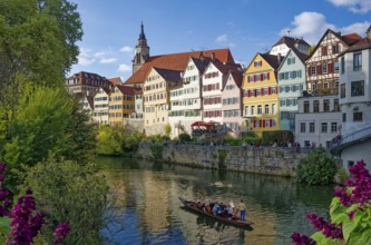 Historic houses on the Neckar front, the Neckar river with poking and water reflection, old town of