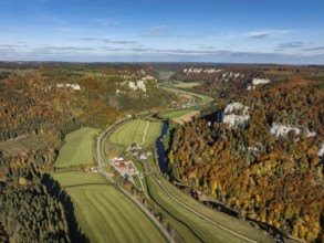 Aerial view of Upper Danube Valley surrounded by autumn vegetation, on the horizon Werenwag Castle,
