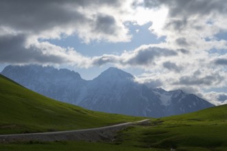 Mountain panorama with green hills and passing clouds, Zagari Pass, Svaneti, Greater Caucasus, High