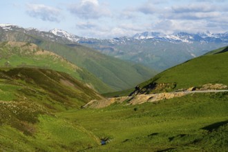 Panorama of a mountainous landscape with green hills and a road, Zagari Pass, Svaneti, Greater