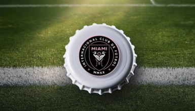 Bottle cap featuring the Inter Miami logo placed on a football field, symbolizing team loyalty and