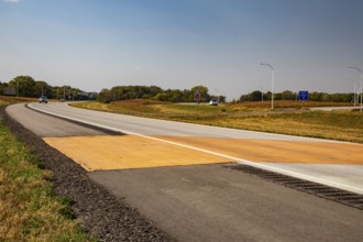 Blue Earth, Minnesota - A 'Golden Stripe' of yellow pavement marks the spot where Interstate 90 was