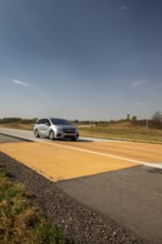 Blue Earth, Minnesota - A 'Golden Stripe' of yellow pavement marks the spot where Interstate 90 was