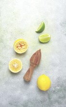 Wooden citrus reamer, manual lemon juicer, made of acacia wood, with citrus fruits on the table,
