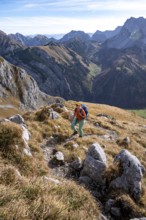 Female hiker on hiking trail, hiking to Gamsjoch, down the Ahornboden valley, eastern Karwendel,
