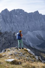 Female hiker on hiking trail, hiking to Gamsjoch, behind Dreizinkenspitze and Laliederer Wand,