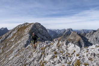 Hikers on steep Gradweg, hiking to Gamsjoch, eastern Karwendel, Tyrol, Austria
