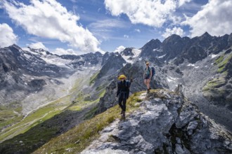 Two mountaineers on a mountain ridge, climbing to the summit of Mont de la Blana, view of rocky