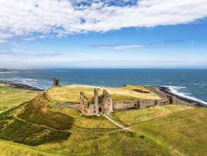 Dunstanburgh Castle from a drone, Northumberland Coast, England, United Kingdom