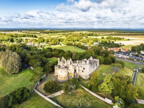 Ruins of Dirleton Castle & Gardens from a drone, Dirleton, East Lothian, Scotland, UK