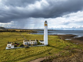 Rain Clouds over Barns Ness Lighthouse from a drone, Dunbar, East Lothian, Scotland, UK