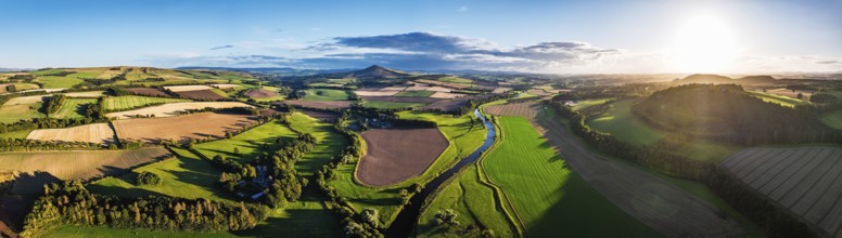 Panorama of evening Fields and Farms over River Teviot and Minto Crags from a drone, Roxburghshire,