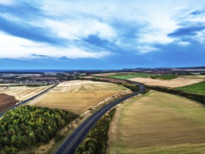 Sunset of Fields and Farms over Traprain Law and Hailes Castle from a drone, River Tyne,